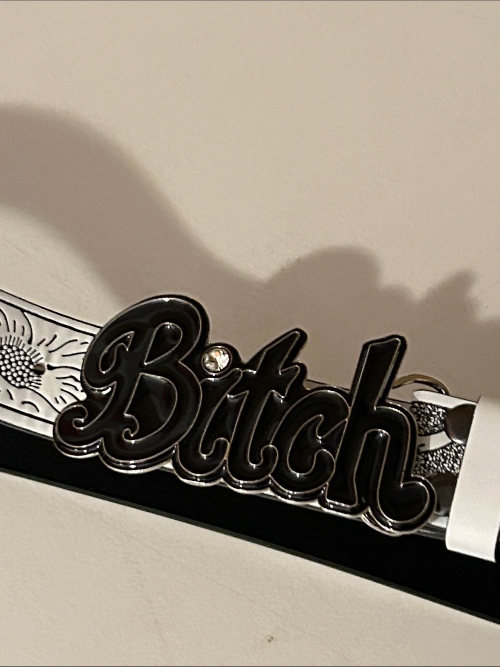 Bi##h Belt Buckle with white and black tooled leather belt size 36 to 39”